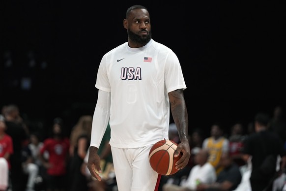 Team USA&#039;s LeBron James looks on before their match against Australia at the USA Basketball Showcase in Abu Dhabi, United Arab Emirates, Monday, July 15, 2024. (AP Photo/Altaf Qadri)
