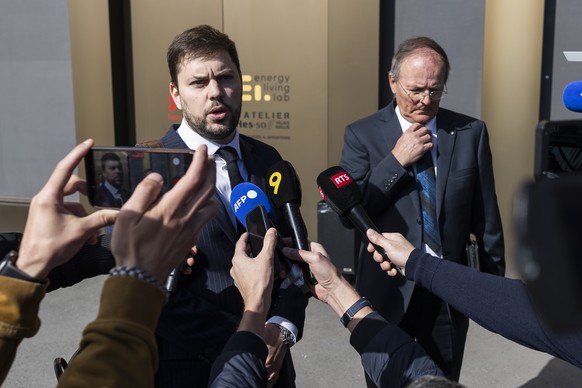 Bryan Pitteloud, left, lawyer, Jean-Claude Savoy, right, former president of the municipality of Chermignon, speak to journalists, during the public prosecutor of the canton of Valais, following the d ...