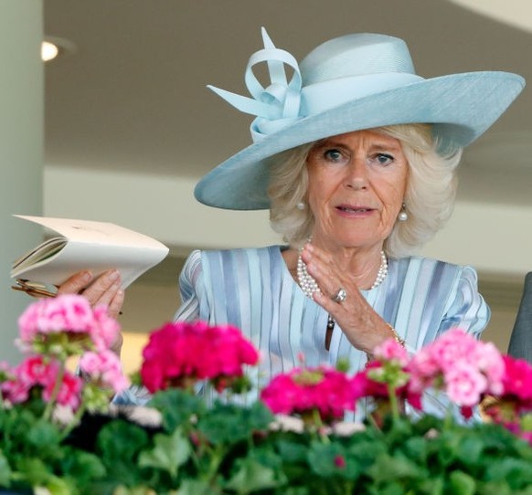 ASCOT, UNITED KINGDOM - JUNE 24: (EMBARGOED FOR PUBLICATION IN UK NEWSPAPERS UNTIL 24 HOURS AFTER CREATE DATE AND TIME) Queen Camilla, King Charles III and Lady Gabriella Windsor watch, from the Royal ...