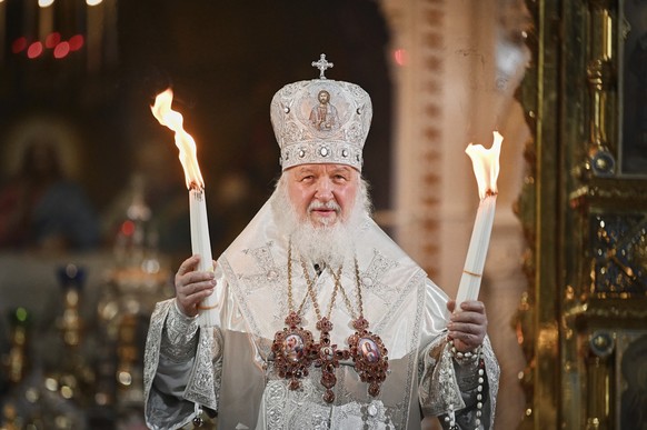 In this handout photo released by Russian Orthodox Church Press Service, Russian Orthodox Church Patriarch Kirill conducts the Easter service at the Christ the Savior Cathedral in Moscow, Russia, late ...