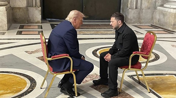 epaselect epa12057132 A handout picture made available by the Ukraine Foreign Affair Ministry shows Ukrainian President Volodymyr Zelensky (R) meeting with US President Donald Trump (L) as they attend ...