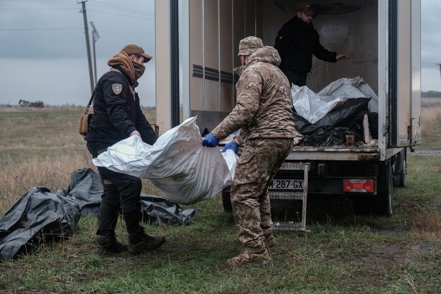 epa12471844 Volunteer members of the Ukrainian recovery group &#039;Platforma&#039; work to identify the remains of several Russian soldiers killed in combat on the Donbas frontline, Ukraine, 21 Octob ...