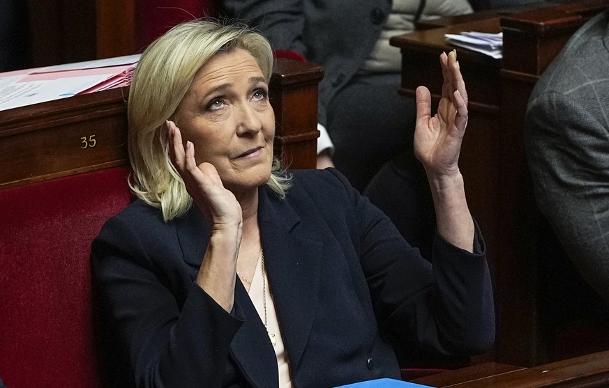 French far-right National Rally party leader Marine Le Pen reacts during the speech of French Prime Minister Gabriel Attal at the National Assembly, Tuesday, Jan. 30, 2024 in Paris. French Prime Minis ...