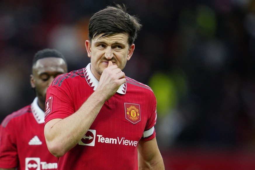 Manchester United&#039;s Harry Maguire grimaces on the halftime during the English FA Cup quarterfinal soccer match between Manchester United and Fulham at the Old Trafford stadium in Manchester, Engl ...