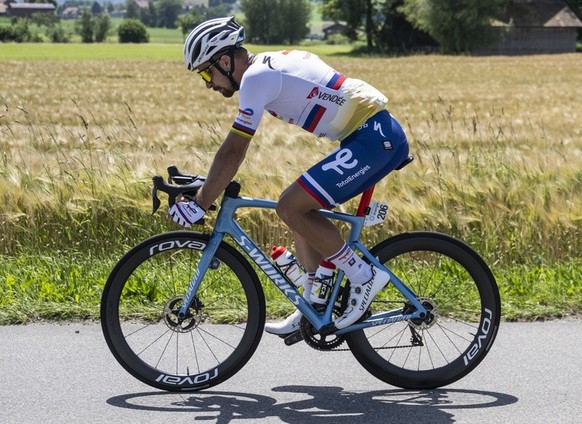 Peter Sagan from Slovakia of Total Energies, left, and Daniell Oss from Italy of Total Energies in action during the fourth stage, a 190.8 km race from Grenchen to Brunnen, at the 85th Tour de Suisse  ...