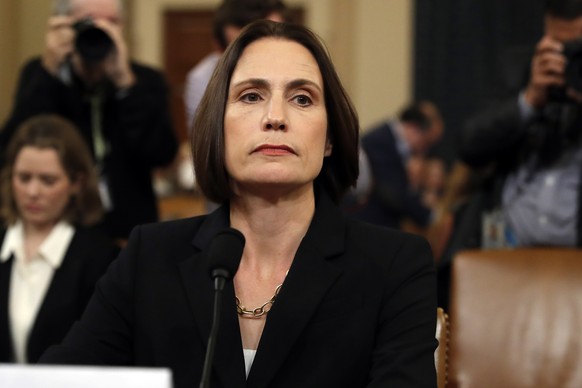 Former White House national security aide Fiona Hill returns from a break to testify before the House Intelligence Committee on Capitol Hill in Washington, Thursday, Nov. 21, 2019, during a public imp ...