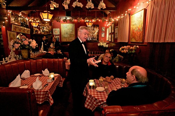 WEST HOLLYWOOD, CA  MARCH 7, 2009  Waiter Vladimir Bezak interacting with customers Lee Mlejnek, cq, 62, RT, of San Francisco, and Edward Buliavac, cq, 64, of La Ca-ada, at Dan Tana's restauran ...