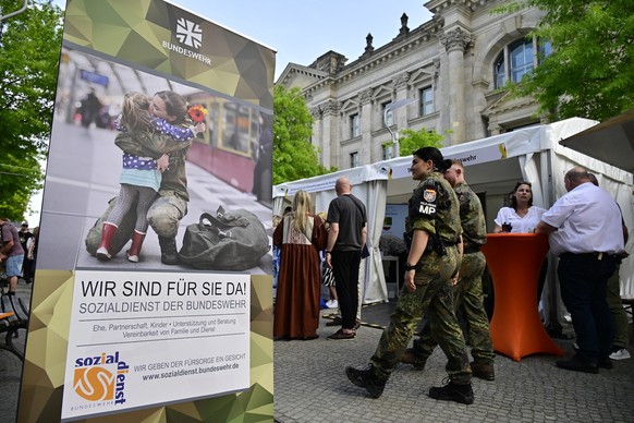German military police officers pass by stands on the occasion of Germany&#039;s first National Veterans Day, on June 15, 2025 in Berlin. (Photo by John MACDOUGALL / AFP)