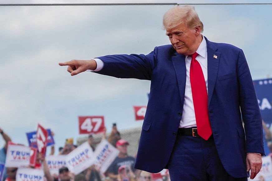 Republican presidential nominee former President Donald Trump points during a campaign rally at North Carolina Aviation Museum, Wednesday, Aug. 21, 2024, in Asheboro, N.C. (AP Photo/Julia Nikhinson)