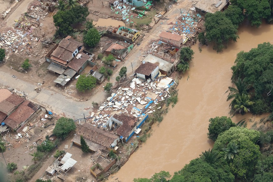 epa09639531 A handout photo made available by the Presidency of Brazil shows the areas affected by floods, during the visit of the Brazilian president, Jair Bolsonaro, over the city of Itamaraju, Bahi ...