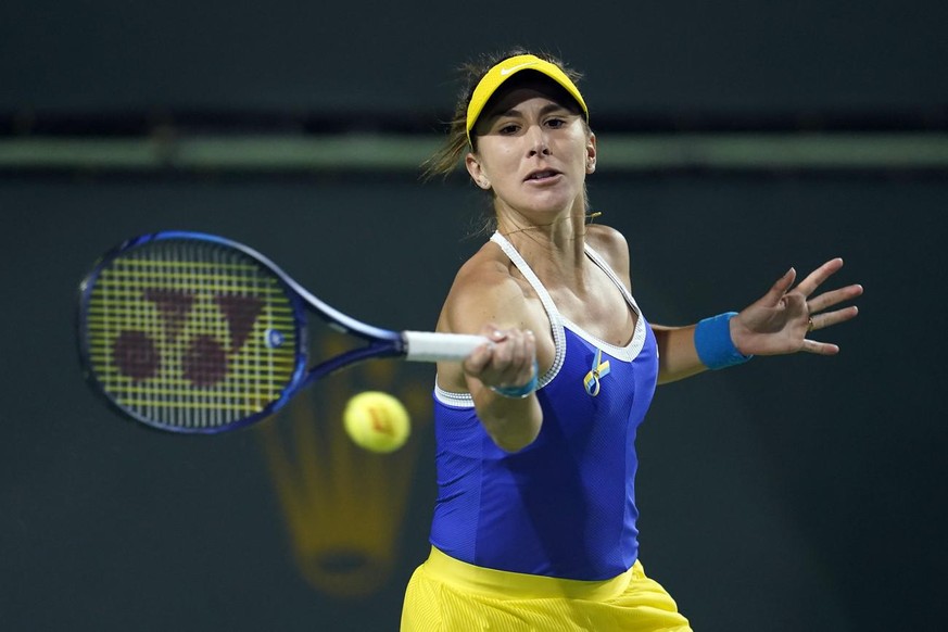 Belinda Bencic, of Switzerland, returns to Kaia Kanepi, of Estonia, at the BNP Paribas Open tennis tournament Friday, March 11, 2022, in Indian Wells, Calif. (AP Photo/Marcio Jose Sanchez)