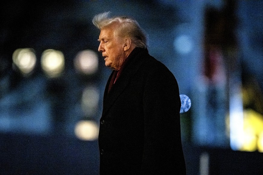 epa12582037 US President Donald Trump walks on the South Lawn of the White House after arriving on Marine One in Washington, DC, USA, 09 December 2025. Trump said people were &#039;starting to learn&# ...