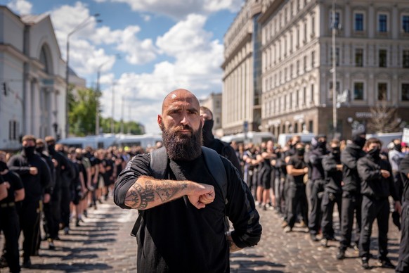 Representatives of right-wing organisations lined up on the street during a protest against the annual 'KyivPride' Equality March in Kyiv, Ukraine, Sunday, June 21, 2026 (AP Photo/Dan Bashak ...