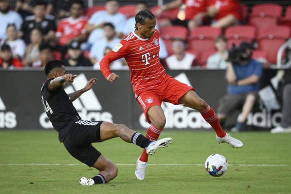 Bayern Munich forward Leroy Sané, right, and D.C. United midfielder Andy Najar (14) vie for the ball during the first half of a friendly soccer match Wednesday, July 20, 2022, in Washington. (AP Photo ...