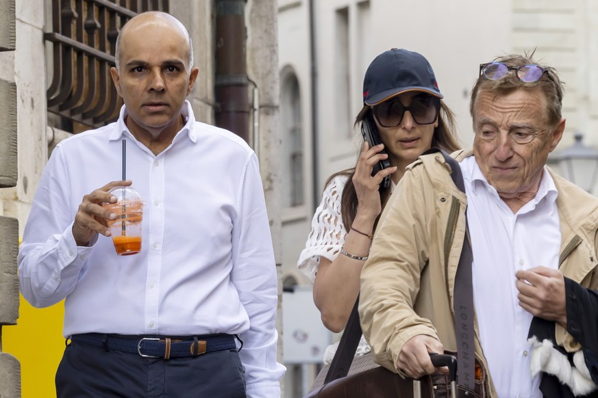 epa11401662 Ajay Hinduja (L) and his wife Namrata arrive with their lawyer Robert Assael at the court house for the resumption day of the trial against members of Indian billionaire family Hinduja, ch ...