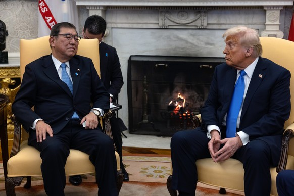 epa11881163 US President Donald Trump (R) meets with Japanese Prime Minister Shigeru Ishiba (L) in the Oval Office at the White House in Washington, DC, USA, 07 February 2025. EPA/ANNA ROSE LAYDEN / P ...