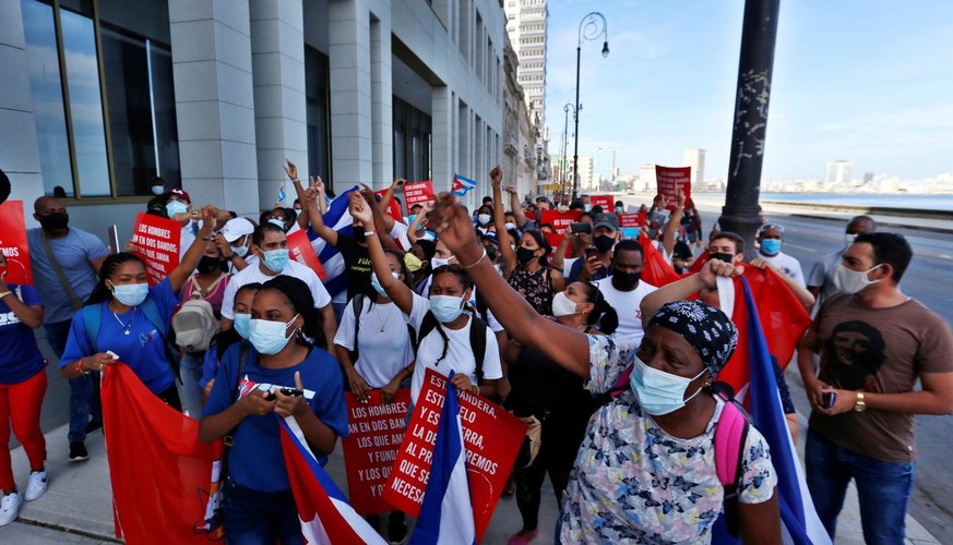 epa09398519 Cubans participate in a march in support of the Cuban revolution through the Malecon area in Havana, Cuba, 05 August 2021. Cubans took to the streets in Cuba on 11 July to protest the gove ...
