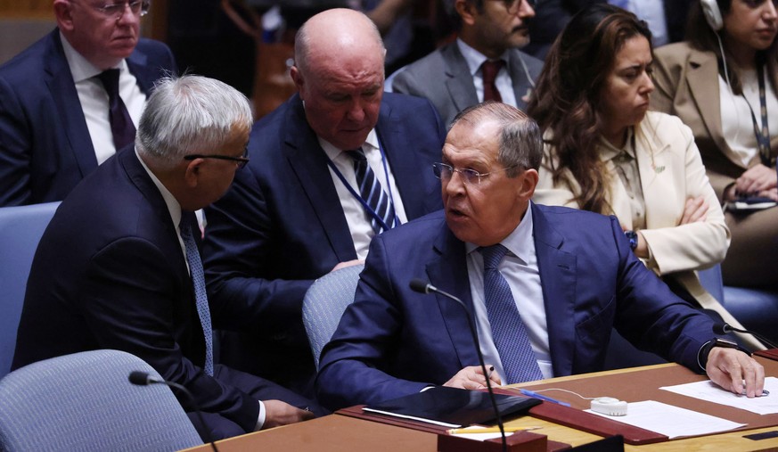 epa10199438 Russian Foreign Minister Sergey Lavrov (R) and Russian Deputy Foreign Minister Sergey Vershinin (L) during a high-level United Nations Security Council meeting about the ongoing conflict i ...
