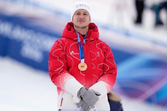 Switzerland's Marco Odermatt poses with the bronze medal of a men's super-G race, at the 2026 Winter Olympics, in Bormio, Italy, Wednesday, Feb.11, 2026. (AP Photo/Julia Demaree Nikhinson)
M ...