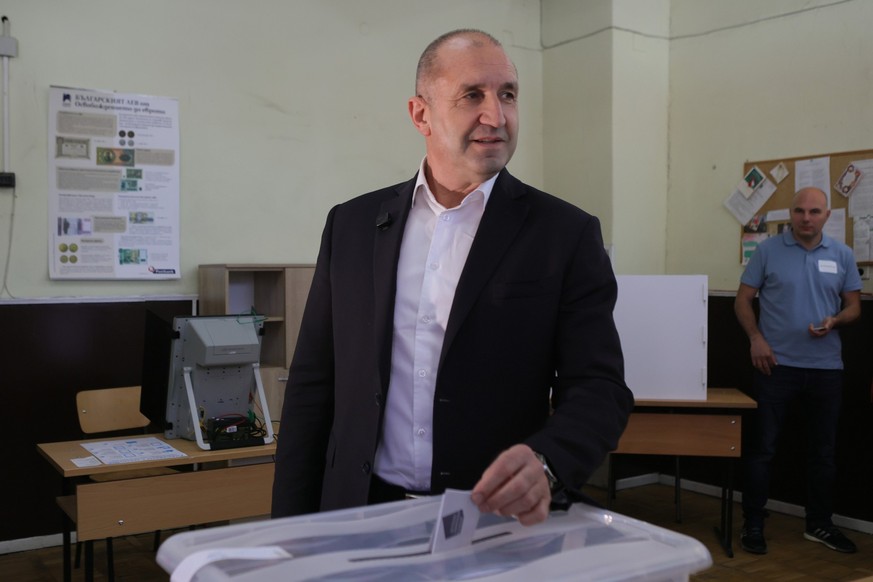 Former Bulgarian President Rumen Radev casts his vote at a polling station in Sofia, Bulgaria, Sunday, April 19, 2026, during early parliamentary elections. (AP Photo/Valentina Petrova)