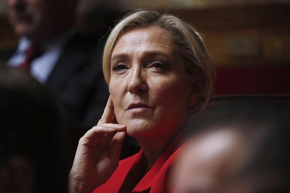 epa08060114 President of French party Rassemblement National (RN) Marine Le Pen looks on during the weekly session of questions to the government, at the French National Assembly in Paris, France, 10  ...