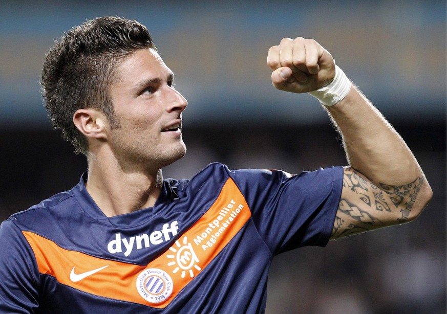 epa03281949 (FILE) A file photograph dated 15 October 2011 shows Olivier Giroud of Montpellier Herault SC celebrating after scoring a goal against Dijon FCO during the French Ligue 1 soccer match at l ...