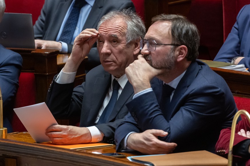 epa11873328 French Prime Minister Francois Bayrou (L) attends a session of the National Assembly to vote on the state budget and the Social Security budget in Paris, France, 03 February 2025. Bayrou a ...