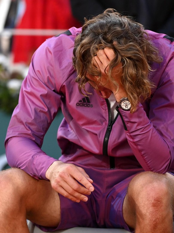 epa09268313 Stefanos Tsitsipas of Greece reacts after losing against Novak Djokovic of Serbia during their final match at the French Open tennis tournament at Roland Garros in Paris, France, 13 June 2 ...