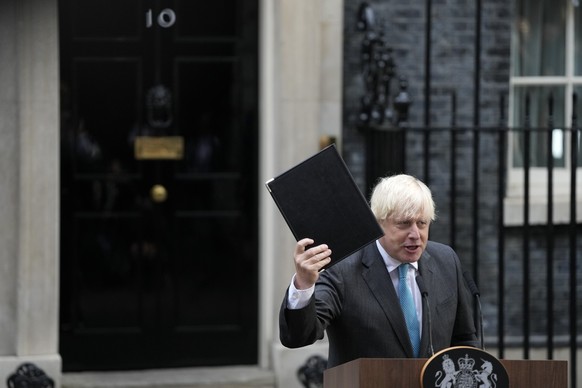 Outgoing British Prime Minister Boris Johnson gestures as he finishes his speech outside Downing Street in London, Tuesday, Sept. 6, 2022 before heading to Balmoral in Scotland, where he will announce ...