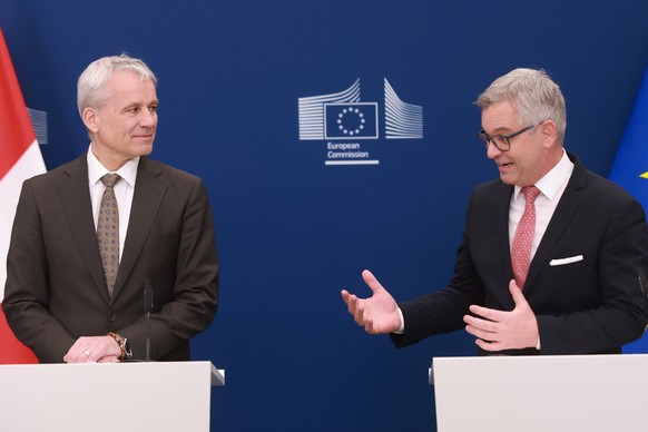 epa12796328 Swiss Federal Councillor Beat Jans (L) and European Commissioner for Internal Affairs and Migration Magnus Brunner (R) attend a press statement ahead of signing an agreement on the exchang ...