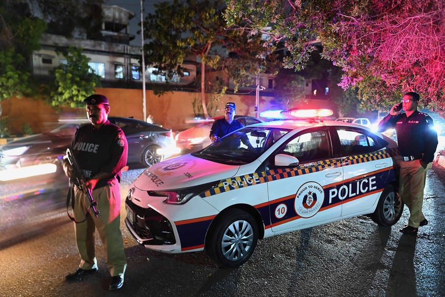 epa13041948 Pakistani security officials stand guard as they check people during the month of Muharram, the first month of the Islamic calendar, in Karachi, Pakistan, 16 June 2026. Security has been i ...