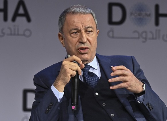epa09852715 Hulusi Akar, Turkey Minister of Defense speaks during the Plenary Session of the final day of Doha Forum at the Sheraton Grand Doha Resort &amp; Convention Hotel in Doha, Qatar, 27 March 2 ...