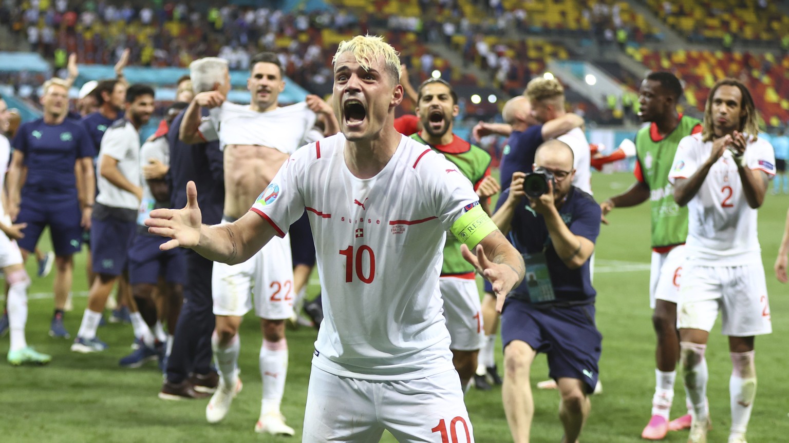 Switzerland&#039;s Granit Xhaka celebrates end of the Euro 2020 soccer championship round of 16 match between France and Switzerland at the National Arena stadium, in Bucharest, Romania, Tuesday, June ...