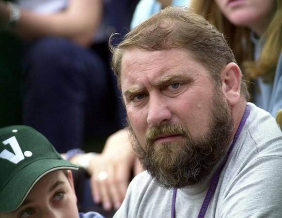 NO COMMERCIAL USE: Damir Dokic father of Australia&#039;s Jelena Dokic watches her in action against Kristina Brandi of America at Wimbledon. (Photo by Michael Stephens - PA Images/PA Images via Getty ...