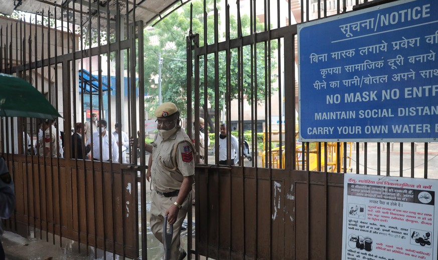epa09485471 A police officer at the Rohini court after a shootout in New Delhi, India 24 September 2021. According to the deputy police commissioner, two assailants killed jailed gangster Jitender ali ...