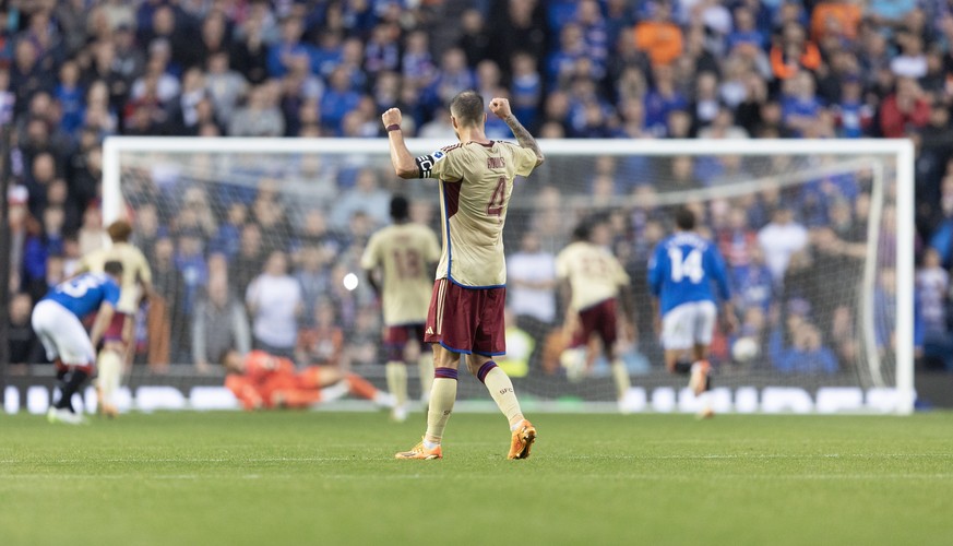 epa10792496 Servette&#039;s Steve Rouiller reacts to his team scoring a penalty during the UEFA Champions League 3rd qualifying round, 1st leg match between Glasgow Rangers and Servette in Glasgow, Br ...