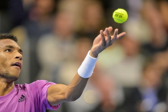 Canada&#039;s Felix Auger-Aliassime serves a ball to Spain&#039;s Carlos Alcaraz during their semifinal match at the Swiss Indoors tennis tournament at the St. Jakobshalle in Basel, Switzerland, on Sa ...