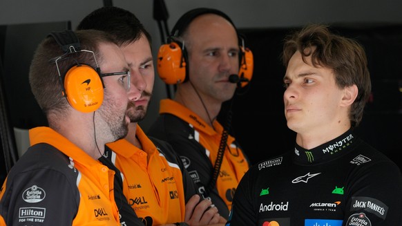 McLaren driver Oscar Piastri of Australia talks with his crew before the sprint qualifying for the Formula One U.S. Grand Prix auto race at the Circuit of the Americas, Friday, Oct. 17, 2025, in Austi ...