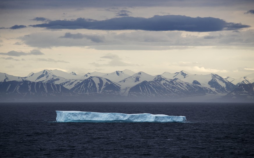 FILE - An iceberg floats past Bylot Island in the Canadian Arctic Archipelago on July 24, 2017. The Associated Press said Tuesday, Feb. 15, 2022, that it is assigning more than two dozen journalists a ...