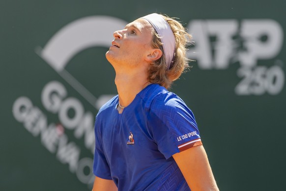 epa09953090 Leandro Riedi, of Switzerland reacts after losing a game against Johan Nikles of Switzerland during their first round match at the ATP 250 Geneva Open tennis tournament in Geneva, Switzerl ...