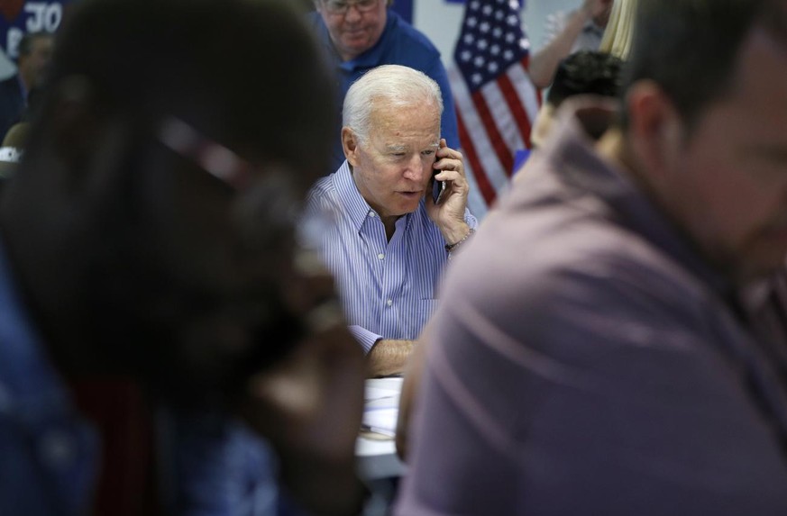 Former Vice President and Democratic presidential candidate Joe Biden calls during a campaign phone bank event an electrical workers union hall Saturday, July 20, 2019, in Las Vegas. (AP Photo/John Lo ...