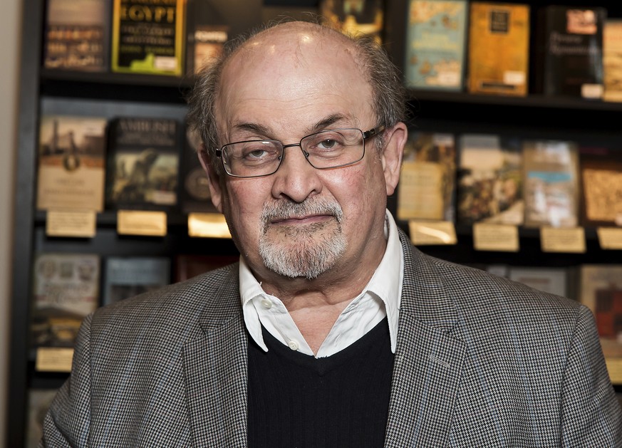 FILE - Author Salman Rushdie appears at a signing for his book &quot;Home&quot; in London on June 6, 2017. Rushdie was attacked while giving a lecture in western New York. An Associated Press reporter ...