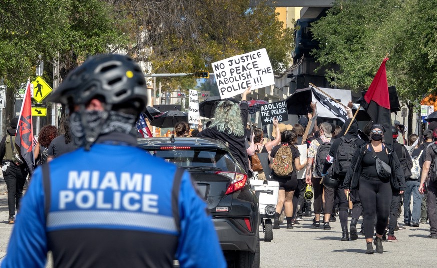 epa09144417 Dozens of protesters demonstrate in response to the officer-involved shooting death of Daunte Wright, through Downtown Miami, Florida, USA, 18 April 2021. On 11 April 2021, Daunte Wright,  ...