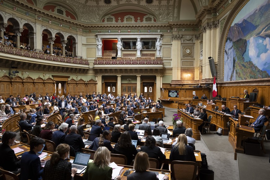 Parlamentarier debattieren waehrend der Fruehlingssession der Eidgenoessischen Raete, am Donnerstag, 19. Maerz 2026 im Nationalrat in Bern. (KEYSTONE/Anthony Anex)