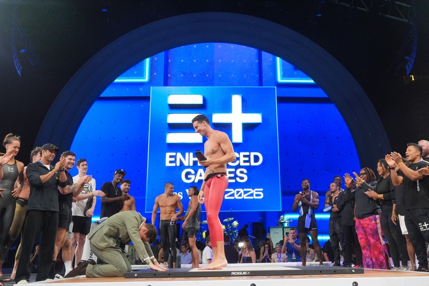 Enhanced Games CEO Maximilian Martin bows before swimmer Kristian Gkolomeev, of Greece, during an award ceremony at the Enhanced Games in Las Vegas, Sunday, May 24, 2026. (AP Photo/Jae C. Hong)
Maximi ...