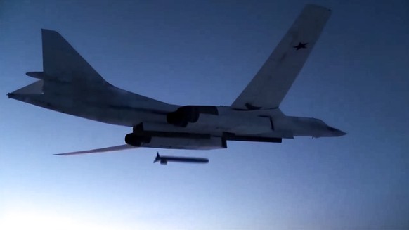 FILE - In this photo taken from a video distributed by Russian Defense Ministry Press Service, on Dec. 9, 2020, a Russian Tu-160 strategic bomber fires a cruise missile at test targets, during a milit ...