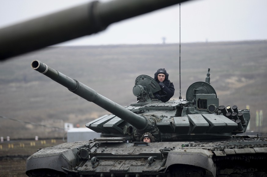 Russian troops take part in drills at the Kadamovskiy firing range in the Rostov region in southern Russia, Tuesday, Dec. 14, 2021. Russia on Tuesday carried out military exercises in the Rostov regio ...