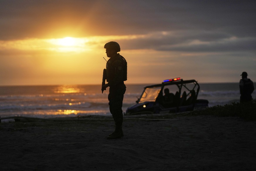 Police guard outside the home of Incumbent President Daniel Noboa as he waits for the results of the presidential election runoff in Olon, Ecuador, Sunday, April 13, 2025. (AP Photo/Fernando Vergara)
 ...