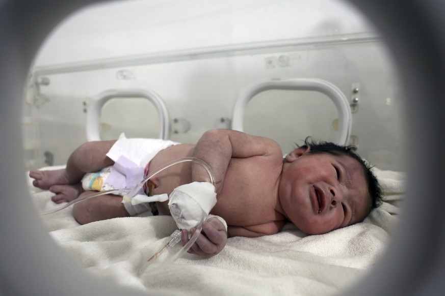 A baby girl who was born under the rubble caused by an earthquake that hit Syria and Turkey receives treatment inside an incubator at a children&#039;s hospital in the town of Afrin, Aleppo province,  ...