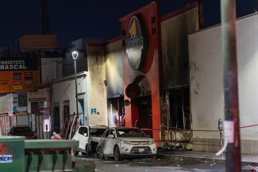 Damaged vehicles are parked in front of a convenience store destroyed by a fire, in Hermosillo, Sonora state, Mexico, Saturday, Nov. 1, 2025. (AP Photo/Abraham Tellez)
Mexico Fire